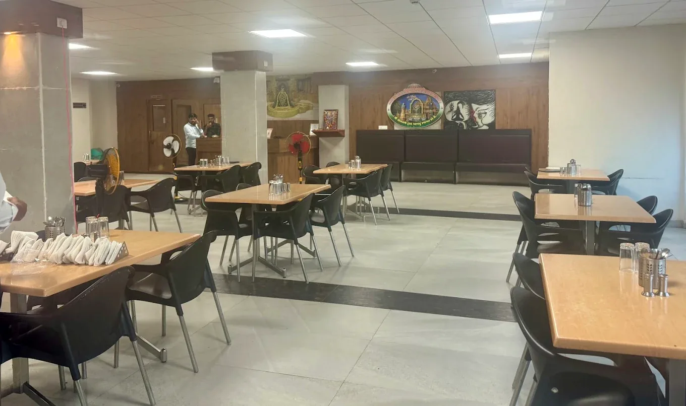 Dining hall with tables at Sagar Darshan Guest House